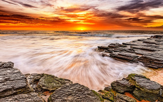 Sunset rocky beach waves jetty - a sunset over a rocky beach free wallpaper