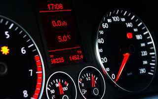 Dashboard speedometer gauges cellphone motionblur - a car dashboard free wallpaper