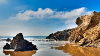 Rocky beach formation water sky - a rocky beach free wallpaper
