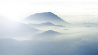 Mountain range fog clouds tower - low free wallpaper