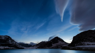 Lake mountains night starry sky 2 - mountain under a cloudy sky free wallpaper