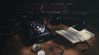 Phone book pocketwatch table brickwall - a phone free wallpaper