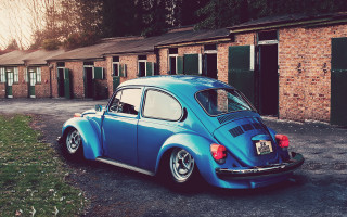 Blue car brick building green - vintage free wallpaper