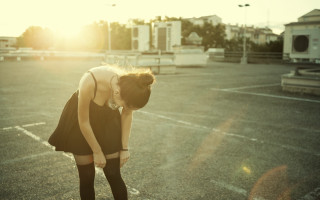 Woman black dress skateboard outdoors - a parking lot free wallpaper