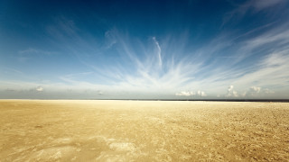 Beach blue sky clouds footprints - free sky wallpaper
