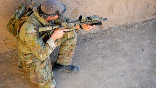 Soldier gun helmet sitting wall - a soldier free wallpaper