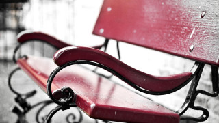 Red bench sidewalk wall blurry - a red bench free wallpaper