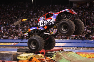 Monster truck mid air dirt 2 - a monster truck free wallpaper