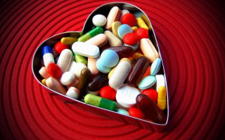 Heart tin pills red background 2 - a red surface free wallpaper
