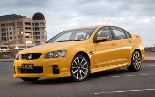 Yellow car parking lot clock - a yellow car free wallpaper