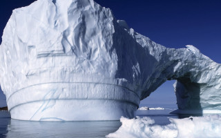 Large iceberg ocean shoreline boat - a shore line free wallpaper