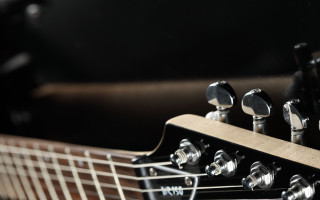 Guitar neck closeup black background 4 - free textures wallpaper