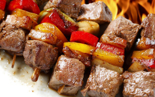 Skewer meat vegetables fire food - fire in the background free wallpaper