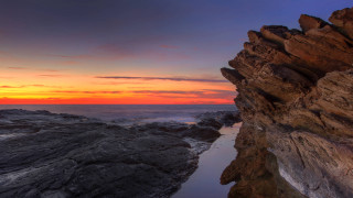 Rocky cliff sunset cloudy sky - a rocky cliff free wallpaper for desktop