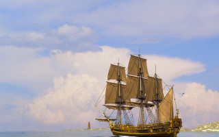 Sailboat ocean cloudy sky lighthouse - fitz henry lane free wallpaper