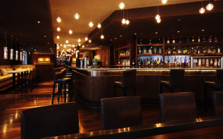 Dimly lit bar stools hanging 3 - bar free wallpaper