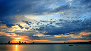Sunset water city lights clouds - colorful cloud free wallpaper
