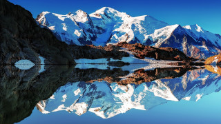 Mountain range lake reflection precisionism - the water below free wallpaper