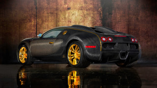 Black gold sports car garage - a wooden wall behind free wallpaper
