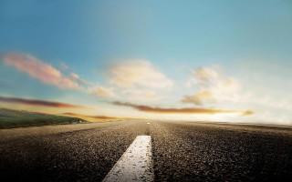 Road clouds sunset cityscape mountains - a white line free wallpaper