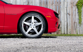 Red sports car wooden fence - low angle free wallpaper