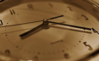 Clock closeup brown background black - a close up of a clock free wallpaper