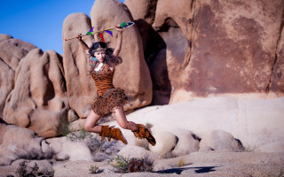 Woman jumping broom rock formation - a broom free wallpaper