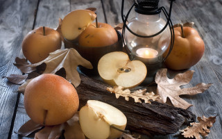 Candle apples leaves wooden table - a lantern free wallpaper for desktop