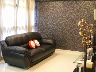 Living room black leather couch - the back of its free wallpaper