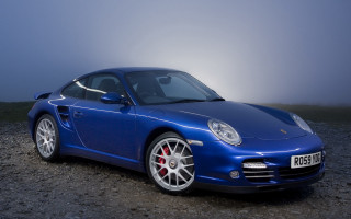 Blue sports car foggy evening - fog in the background free wallpaper