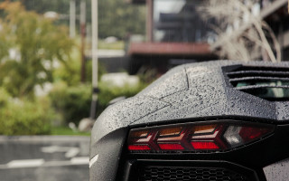 Black sports car rain building - rim free wallpaper