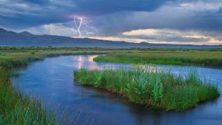 River lightning mountains grass sky - the foreground and mountains free wallpaper