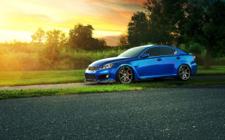 Blue car parked road grassy - a blue car free wallpaper