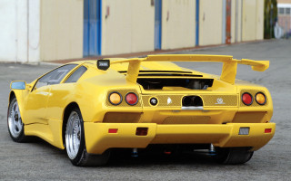 Yellow sports car parking lot 9 - a blue door free wallpaper