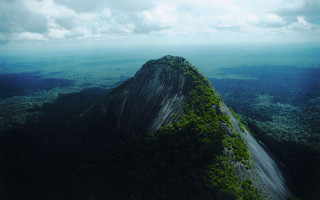Tall green mountain forest cloudy - aerial view free wallpaper for desktop