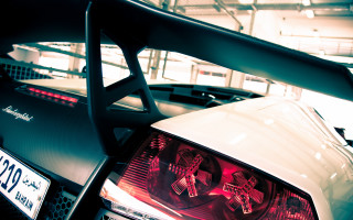 White car red taillight garage - other car free wallpaper