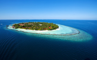 Island boat house ocean scenery - an island in the middle of the ocean free wallpaper