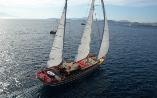 Sailboat red sail distant mountain - neoclassicism free wallpaper