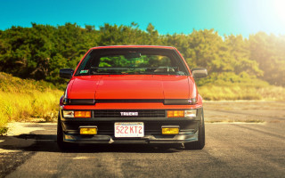 Red car forest road sky - clean line free wallpaper