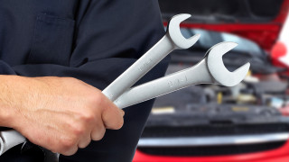 Man holding wrenches car engine - a wrench free wallpaper