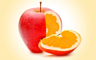 Apple orange halves yellow background - an apple free wallpaper