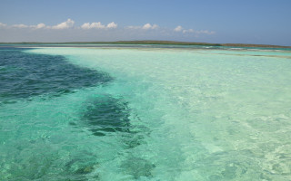 Ocean island boat sky waves - carpoforo tencalla free wallpaper for desktop