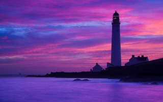 Lighthouse rocky shore purple blue - a rocky shore free wallpaper