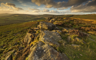 Rocky hillside sunset cityscape clouds - a rocky hillside free wallpaper