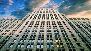 Tall building windows cloudy sky - front of it free wallpaper