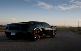 Black sports car evening cloudy - a black sports car free wallpaper for desktop