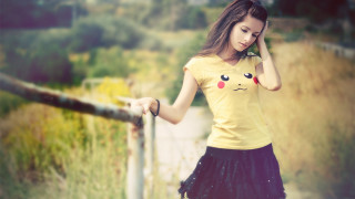 Woman yellow shirt cellphone fence - her ear free wallpaper