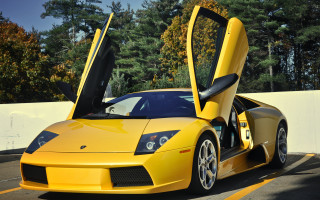 Yellow sports car open doors 5 - a white fence free wallpaper