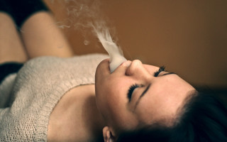 Woman laying smoke blurry photorealistic - her mouth and a cigarette free wallpaper