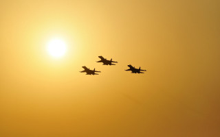Airplanes sunset silhouette moon orange - the sun behind them free wallpaper